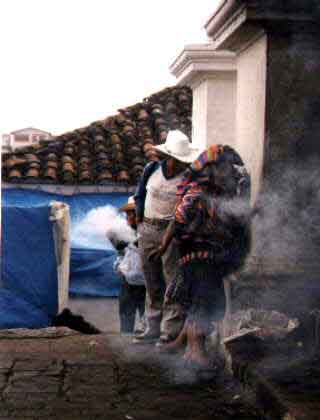 Lady swinging a pot of smoking incence