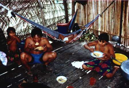 Family eating dinner in the hut